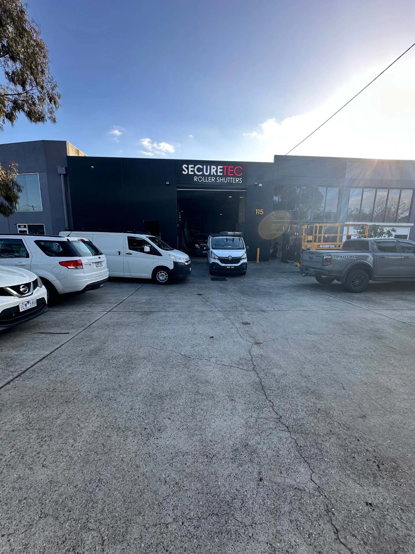 Securetec Roller Shutters workshop at 115 Miller Street, Epping, with vans parked out front