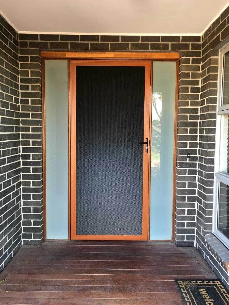Security screen door installed at a residential entrance